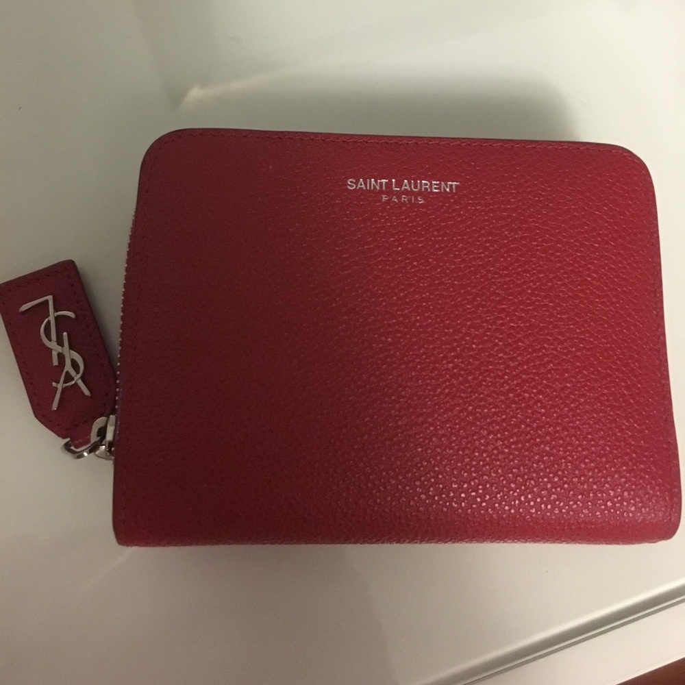 YSL red leather wallet. Some wear to it.